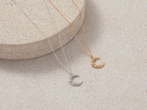 Silver and gold crescent moon necklaces